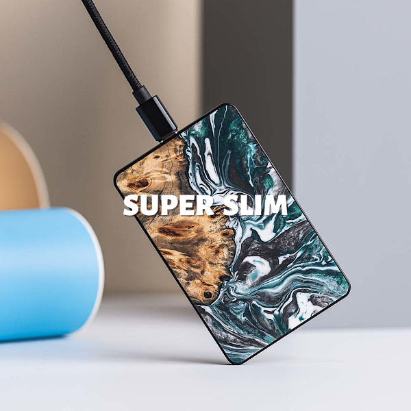 A super slim wireless phone charger made of colored resin and wood.