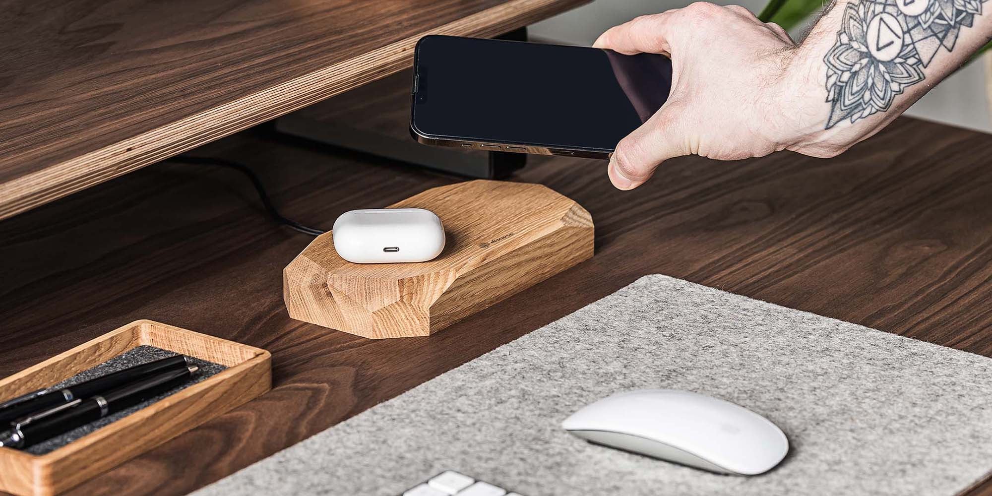 Aesthetic dual wireless charger made of solid oak wood.